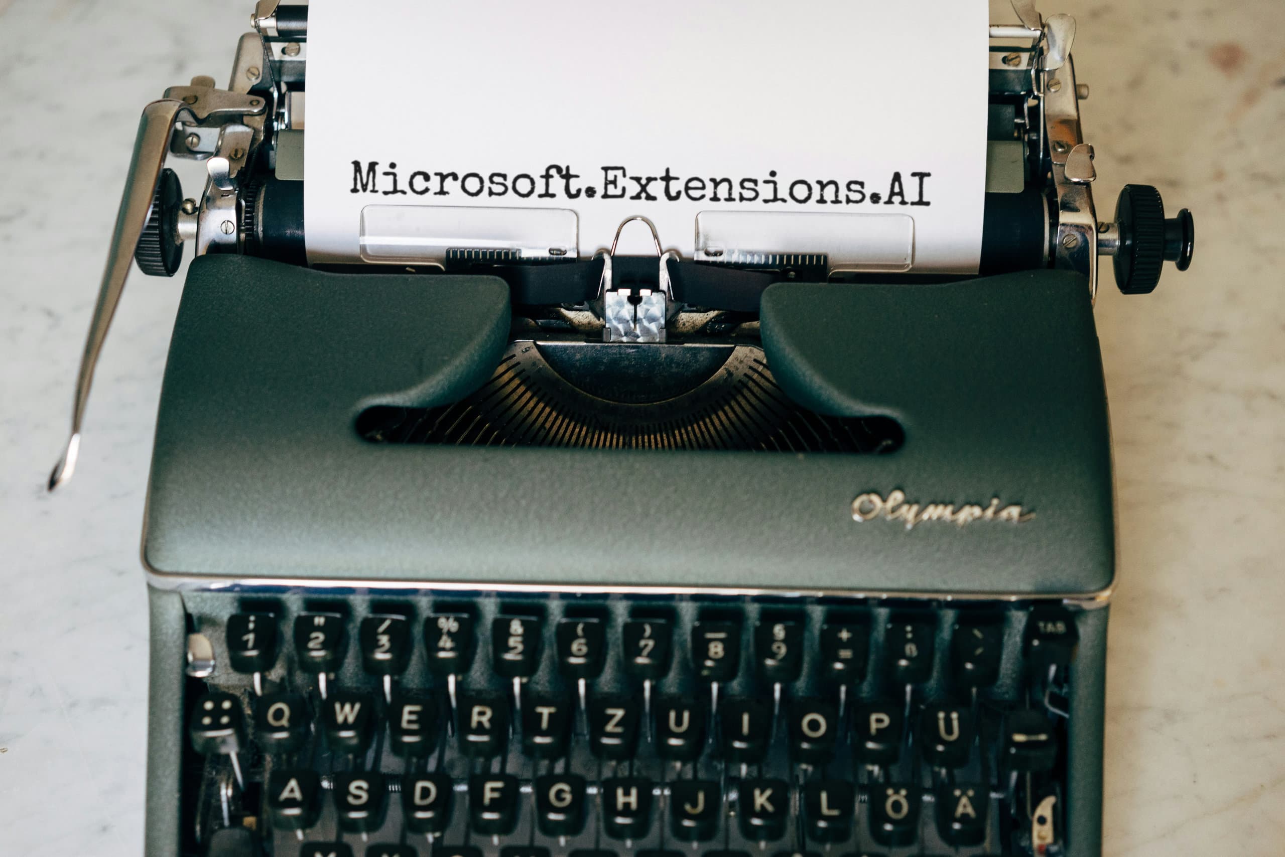 Old fashioned typewriter typing the text "Microsoft.Extensions.AI"