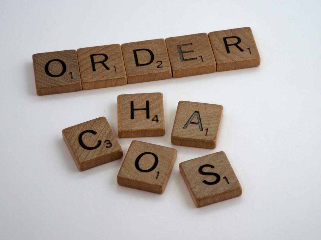 Scrabble words reading "Order" and "Chaos"